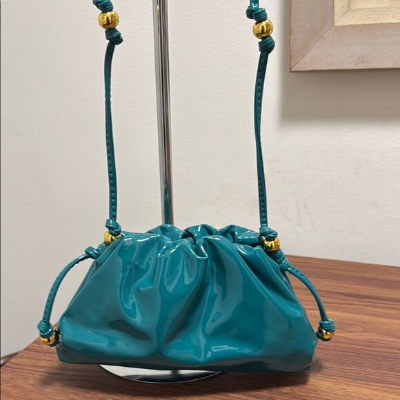 NWOT Cloud Pleated Mini Cross Body Bag in Teal Blue Patent Leather/Gold Bead. - Picture 1 of 5